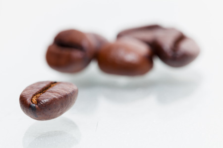 Macro coffee beans isolated on white backgroundの写真素材