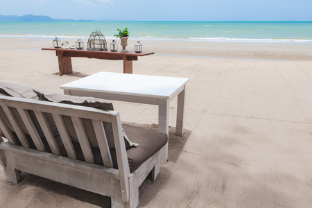 Sofa and table on the beach in Pattaya, Thailand.