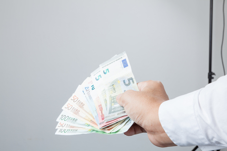 Money in the hand (Hand with money, Hand holding Banknotes), have clipping path.の写真素材