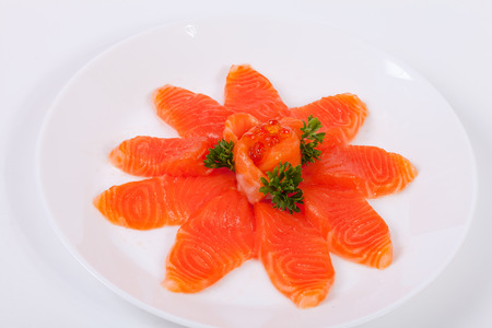 Japanese food salmon sashimi slices on a white plate, isolated white background.の写真素材