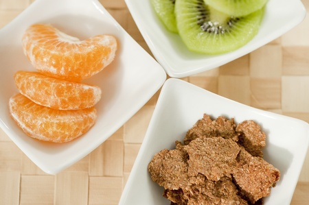 Tangerine, kiwi and cereal a healthy foodの写真素材