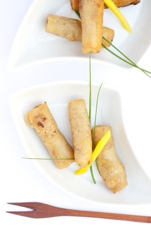 Egg rolls for snack with a knifeの写真素材