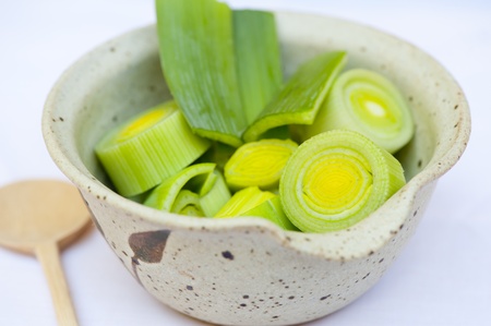 Fresh and raw leek with a spoonの写真素材