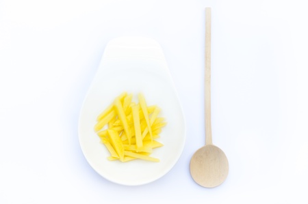 Mango with a spoonの写真素材