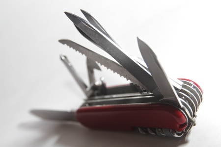 multipurpose knife opened on white background の写真素材