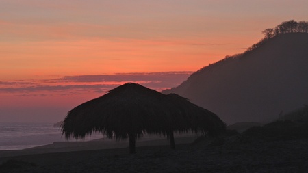 Shack in susnet on the beachの写真素材