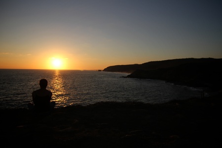 Watching sunsetの写真素材