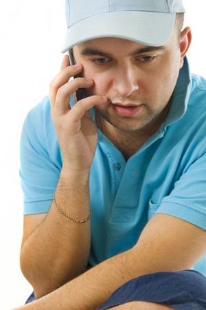 Portrait of a young man speaking on the phoneの写真素材