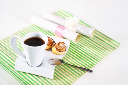 cup of hot coffee and cakes for breakfastの写真素材