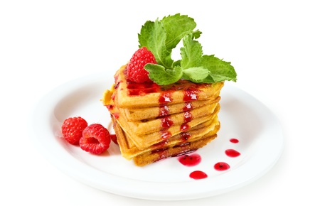 breakfast - waffles with syrup, mint and raspberriesの写真素材