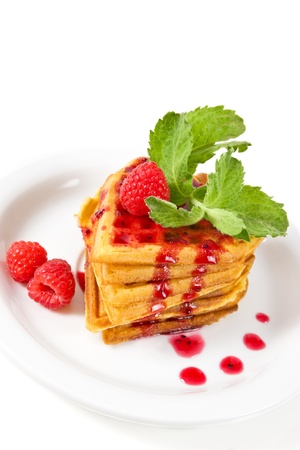breakfast   waffles with raspberries, mint and jam on plateの写真素材