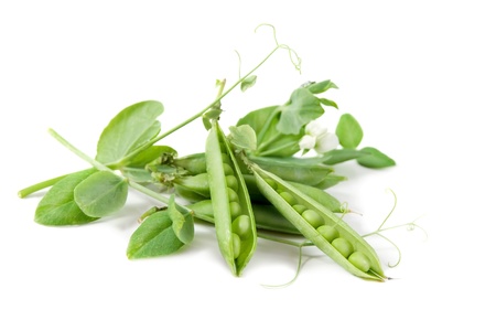 fresh green peas isolated on a white backgroundの写真素材