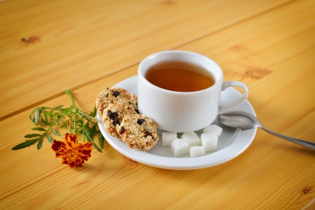 Breakfast still life  Cup of tea and marigoldsの写真素材