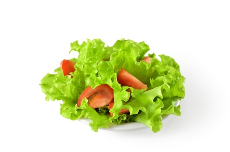 vegetable salad with tomatoes in plateの写真素材