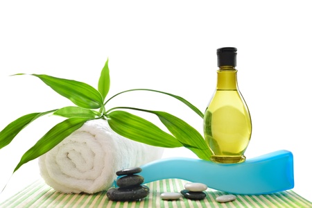 Spa treatment with towels and green bamboo isolated on white background. High resolution image.の写真素材