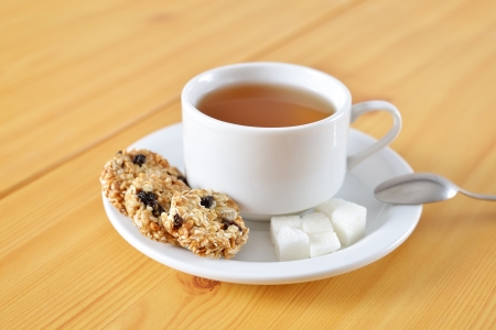 Tea cup with taste cakes and sugarの写真素材