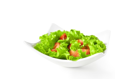 Healthy food background. Vegetable salad with tomatoes in plateの写真素材