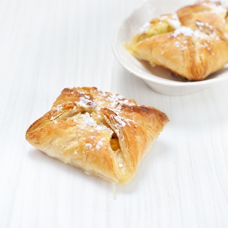 Puff pastry on the wooden white tableの写真素材