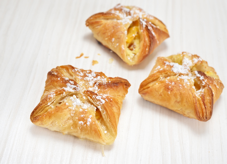 Puff pastry on the wooden white tableの写真素材