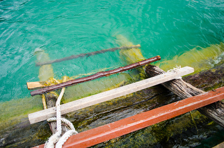 Wood fixed ladder into the lake の写真素材