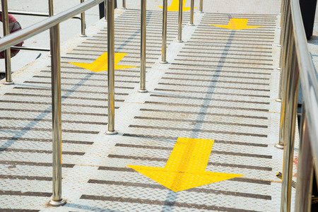 Path with yellow arrowの写真素材