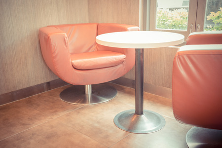 Table and sofa in the barの写真素材