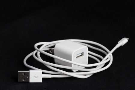 USB phone power charger on black 
