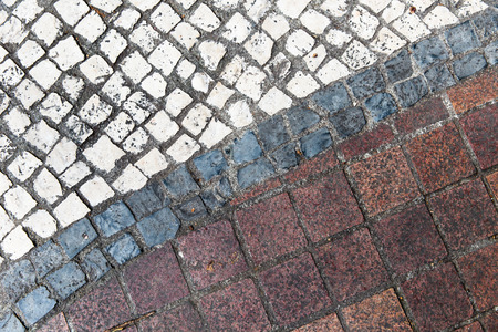 Dirty street side mosaic flooring as backgroundの写真素材