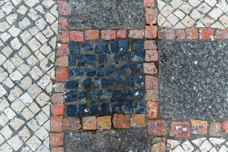 Dirty street side mosaic flooring as backgroundの写真素材