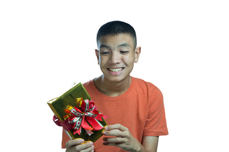 young asian teenager happy to get a gift on blue backgroundの写真素材