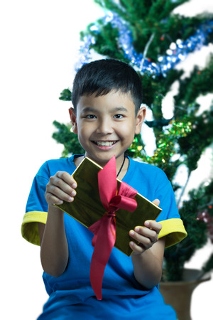 Asian kid smile receive Christmas giftの写真素材