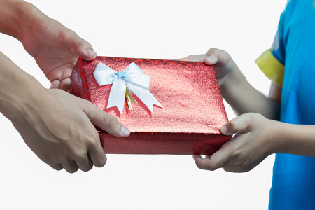 Hands giving and receiving a presentの写真素材