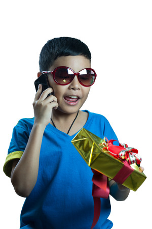 Asian kid call to his friend and tell about a giftの写真素材