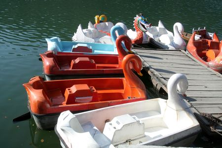 Beautifully shaped colourful boats awaiting the arrival of touristsの写真素材