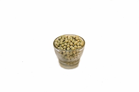 Cup containing seeds of soya bean, isolated on whiteの写真素材