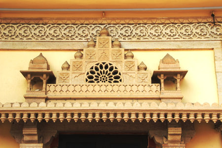 Decorative mortar artwork on top of doorway at Maharaj Sawai Mansingh II Museum, City Palace, Jaipur, Rajasthan, India, Asiaのeditorial素材
