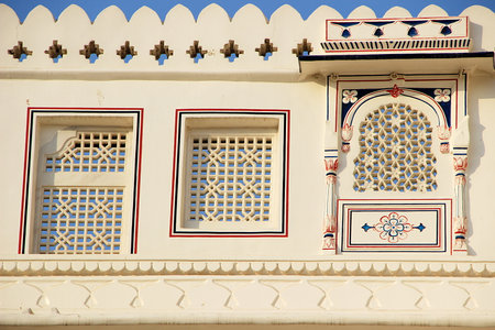 View of windows with geometrically shaped cut-outs on wall of Junagarh Fort, Bikaner, Rajasthan,...