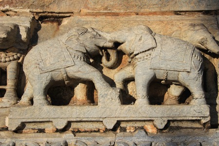 Stone carving of two elephants in combat at Jagadeesh Temple, Udaipur, Rajasthan, India, Asiaの写真素材