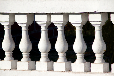 Close-up of moulded concrete posts supporting slab of compoundの写真素材