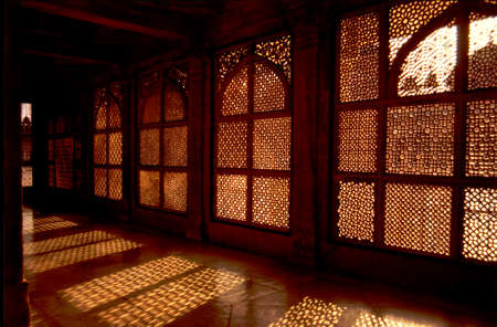 Light and shadow patterns created by evening sunlight through marble windows at Tomb of Chisti in Buland Darwaza in Fatehpur Sikri, Uttar Pradesh, India, Asiaの写真素材