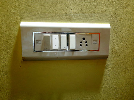 View of modern electrical white switchboard containing, fuse, switches, plug socket fitted on...