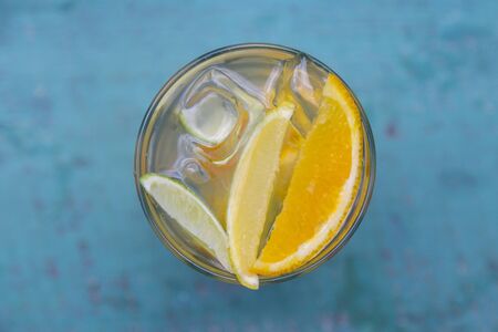 Lemon, orange, lime and ice. A fresh summer non alcoholic fruit and citrus cocktail.の写真素材