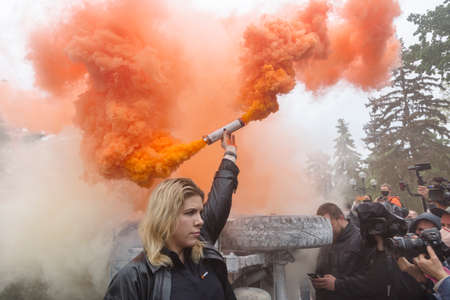 KYIV, UKRAINE - June 05 2020: Kira Rudyk, the new leader of Voice (Holos) â a liberal and pro-European political party in Ukraine, holding an orange smoke on a protest demanding the resignation of Interior Minister Arsen Avakovのeditorial素材