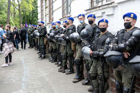 KYIV, UKRAINE - May 21 2021: military police hold helmets on a protest action against police's abuse...