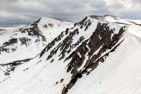 Spring mountains covered with snow. Chornohora mountain range in the Carpathians, Hoverla, Shpytzi,...