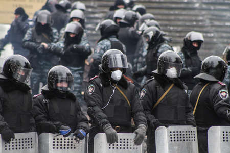 KYIV, UKRAINE - Jan 28 2014: Police in masks on barricades during street fights. The struggle for...