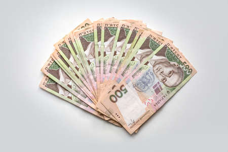 Ukrainian money hryvnya on a white background. The national currency five hundreds banknotes in cash. Close up finance background.の写真素材