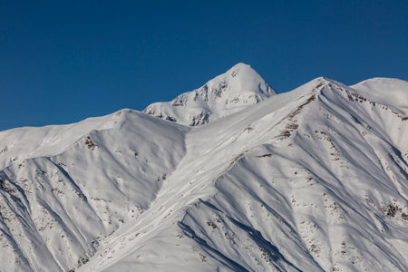 mount Tetnuldi (4858m) is a prominent peak in the central part of the Greater Caucasus Mountain...