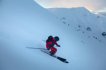 Skier curved on the freeride slope in the big mountains. Winter outdoor conceptの写真素材