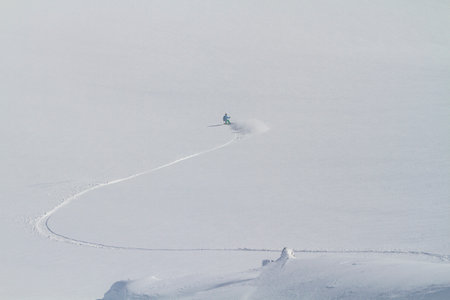 Great snowboarding line on white field, freeride winter activity view from mountain, Aerial Viewの写真素材